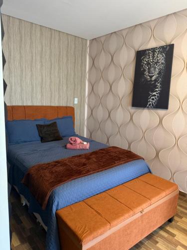 a bedroom with a bed and a picture on the wall at Residencial Beatriz centro in Formosa