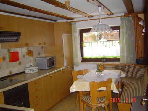 a small kitchen with a table and a window at Haus-Johanna in Riedlhütte