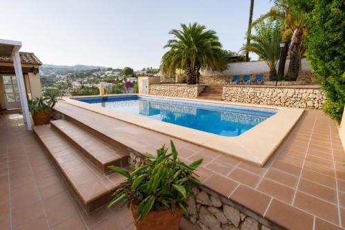a swimming pool in a villa with a resort at Villa Paula in Benissa