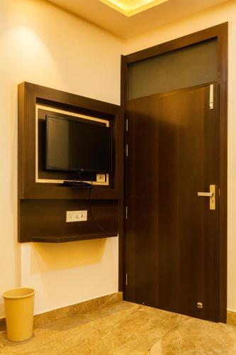 Televisor o centre d'entreteniment de Hotel Urban Stay - By Silver Hospitality