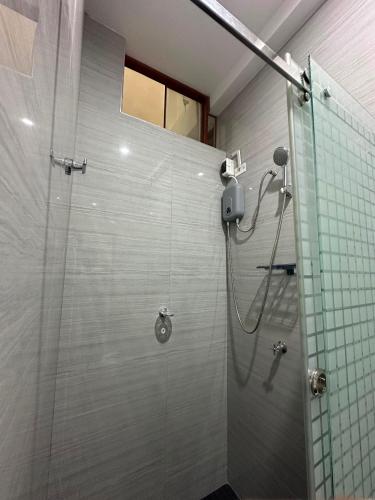 a bathroom with a shower with a glass door at Sol de sauce - Casa Vacation Stay in Sauce