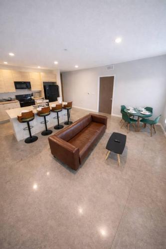 a large living room with a couch and tables at Cozy Greenwood Canopy in Des Moines