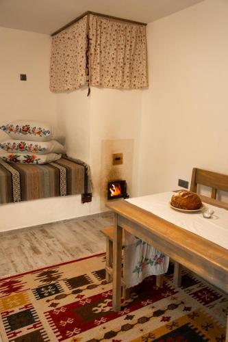 a room with a table and a bed at Екопоселення Верболози in Misaylovka