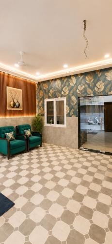 a living room with a couch and a fireplace at Hotel RK Plaza - Rukmani vihaar - #Parking #Best Rated Area #Fully Ac #Prem Mandir #Chaar Dhaam in Vrindāvan