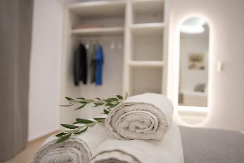 a pile of towels sitting on top of a room at Aurora Horizon Naxos in Glinádhon