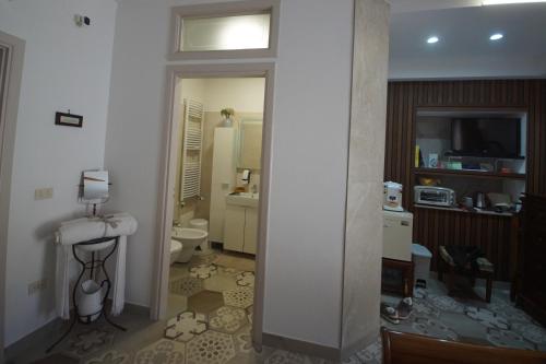 a small bathroom with a toilet and a sink at B&b Sant'Agata in Sant'Agata de' Goti