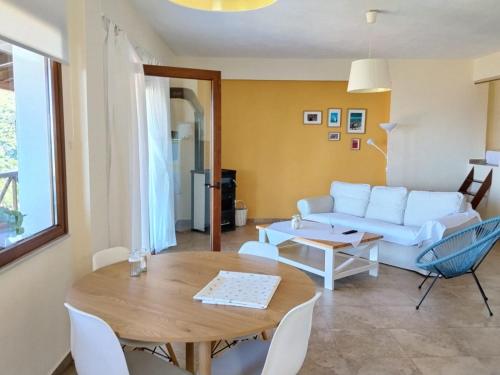 a living room with a couch and a table at Perfect View House in Sotír