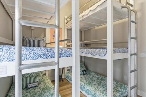 a couple of bunk beds in a room at Modern Lakefront Escape | The Twelve in Camdenton