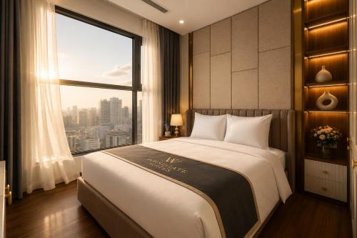 a bedroom with a large bed with a large window at H-Vista WestGate Suites in Hanoi