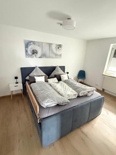 a bedroom with a large bed in a room at Casa-Heckl in Tutzing