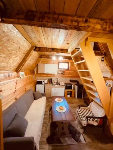 a living room with a couch and a table at Durmitor Hideaway in Žabljak
