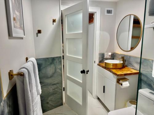 a bathroom with a shower and a mirror at Wood & White in Hialeah