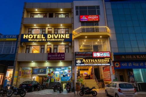 a hotel dmg with motorcycles parked in front of it at Hotel Devine Opp Jubilee Walk Mall & Near Gurdwara Sohana in Sohāna