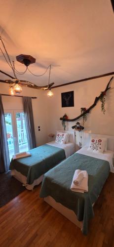 a hotel room with two beds in a room at Full 3 Bedroom Apt-Summer Deal in Kerkini