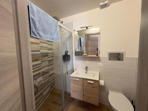 a bathroom with a shower and a sink and a toilet at Struttura Le Gemme in Marettimo