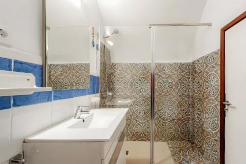 a bathroom with a sink and a shower at Molino Son Moll in Cala Ratjada