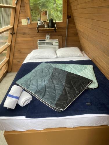 a room with two beds in a cabin at Loblolly Pines Adventure Aframe #2 in Eureka Springs