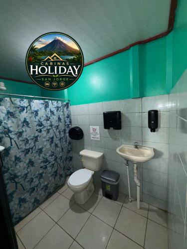a bathroom with a toilet and a sink at Holiday San Jorge in Fortuna