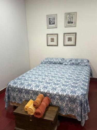 a bedroom with a bed with towels on a table at Casa familiar in Corrientes