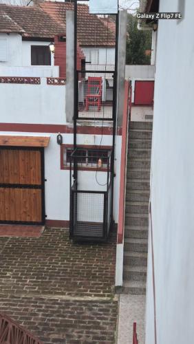 a set of stairs leading up to a building at Complejo AleMar in San Clemente del Tuyú