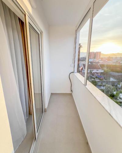a balcony with a view of a city at Modern Air Conditioned 2BR in Heart of Shkodër in Shkodër