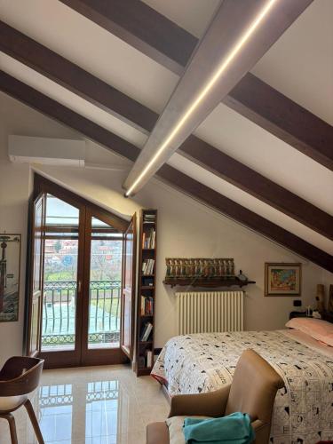 a bedroom with a bed and a large window at Toni's in Pianillo