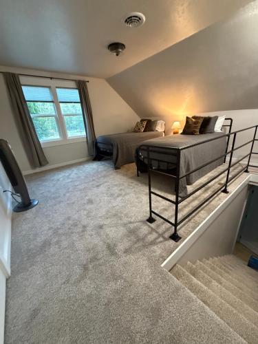 a bedroom with two beds and a television in it at Home Town Mountain Lodging 2 in Darby