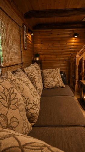 a bedroom with two beds in a log cabin at The DACHA escape in Viimsi