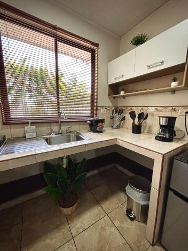 a kitchen with a sink and a counter top at Apartamento Aura 10 in El Coco