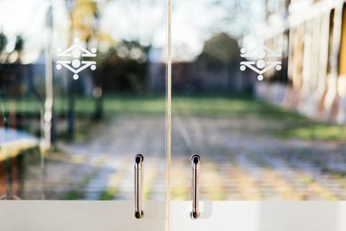 a view of a train station through a window at Parador de Manzanares in Manzanares