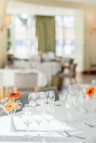 a group of wine glasses on a table at Parador de Manzanares in Manzanares
