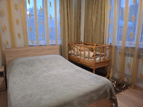 a bedroom with a bed and a window at Melkonyan's home in Gyumri