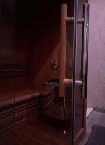 a shower in a bathroom with a glass door at Maison RoHa - B&B & Wellness in Dinant