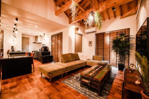 a living room with a couch and a table at The Villa Miyako in Hirara