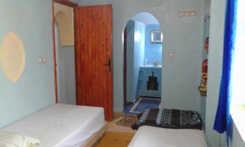 Katil atau katil-katil dalam bilik di Chez Belkacem