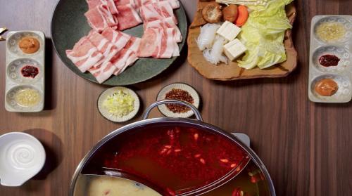 a table topped with different types of food on plates at 結びの小宿 縁 by Wellbe in Kobe