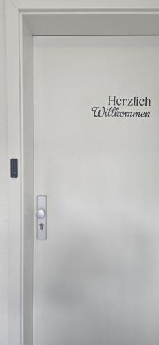 a door with a sign on the side of it at Aaberg Lounge in Waldshut-Tiengen