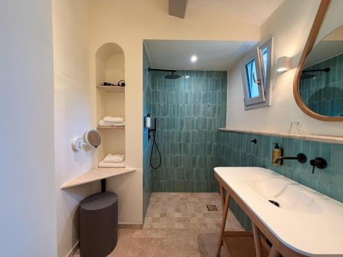 a bathroom with a sink and a shower at Hotel Mas Des Barres in Saintes-Maries-de-la-Mer