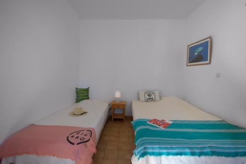two beds sitting next to each other in a room at Sélection Camping La Croix -Valmer in La Croix-Valmer