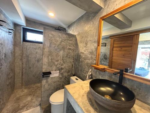 a bathroom with a large bowl sink on a counter at Big leaf villa kohsamui in Bangrak Beach