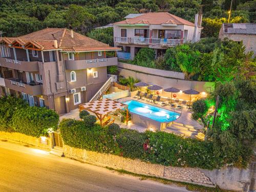 an aerial view of a house with a swimming pool at Holiday Sea View Villas in Katastárion
