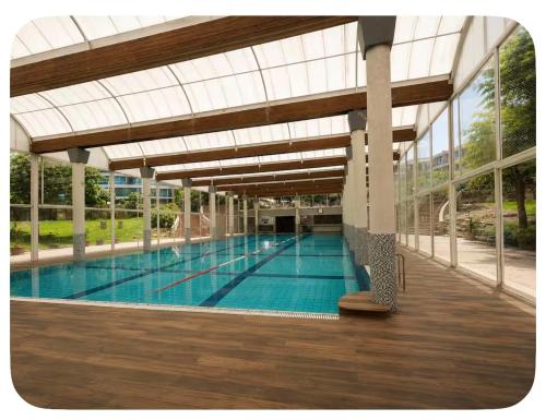 a large swimming pool with a glass ceiling at חופשה חלומית in Caesarea