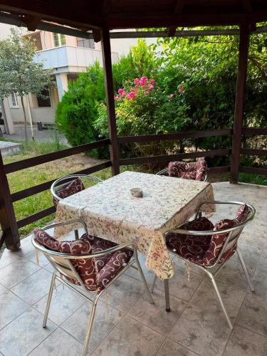a table and chairs sitting on a patio at Villa Vera in Vrnjačka Banja