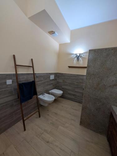 a bathroom with a toilet and a sink at Thamani Apartment Zanzibar in Pwani Mchangani