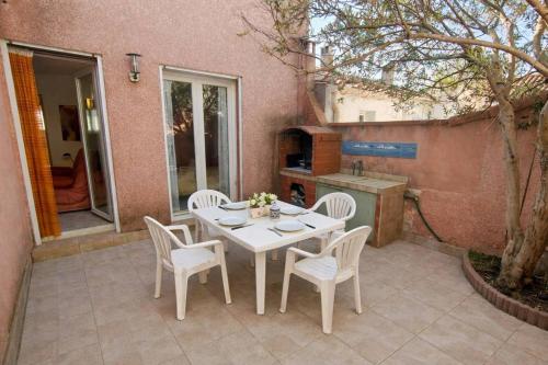 Évasion plage : maison avec patio, climatisation, 50 M de la plage 4POIT11
