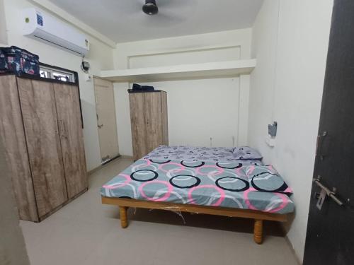 a bedroom with a bed in a room at Home Nest in Anand