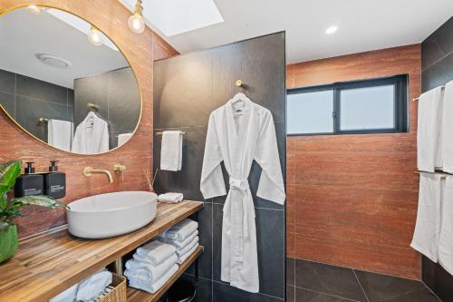 a bathroom with a sink and a mirror at Dundalli Lodge in Conondale