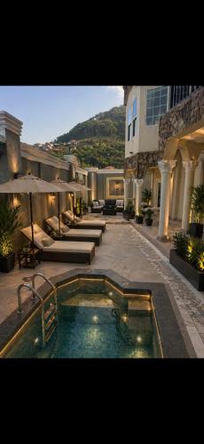 a swimming pool in the middle of a building at Richcastle Hotel in Freetown