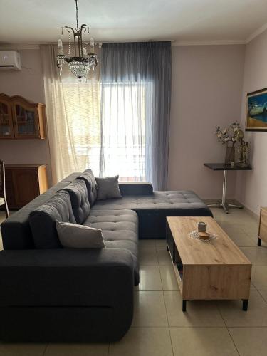 a living room with a couch and a coffee table at Artistic Retreat in Nafplio