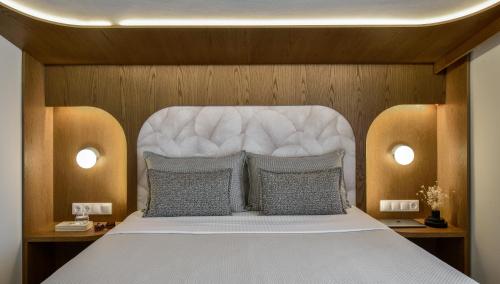 a bedroom with a large white bed with two pillows at Epineio Comfort Living in Litochoro
